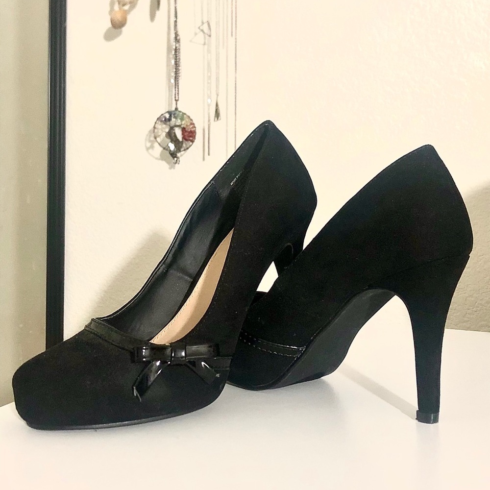 Chic black high heels with accented bow